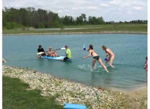 Christmas in May 2015 - kids have a water fight in the pond at my sister's house.